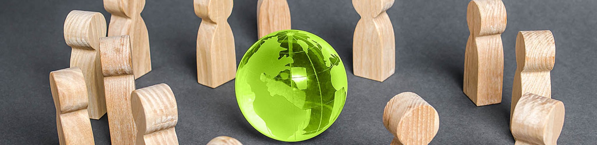 People surrounded a glass globe. cooperation and collaboration of people around the world. Outsourcing and joint work on projects. Diplomacy. crowdfunding. Preserving environment, caring for nature
